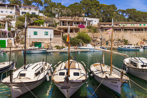 Cala Figuera, Spain -April 20, 2024: Beautiful view of the quaint fishing boats moored in Cala Figuera's harbor, set in a picturesque bay that is a popular spot on Mallorca's southeastern coast.