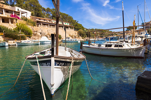 Cala Figuera, Spain -April 20, 2024: Picturesque setting of Cala Figuera's fishing harbor with its small boats, located in a beautiful bay that is a top attraction for tourists visiting southeastern Mallorca.