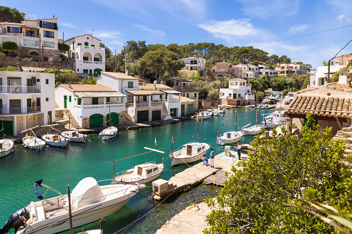 Cala Figuera, Spain -April 20, 2024: View of Cala Figuera's fishing harbor, dotted with quaint fishing boats. Nestled in a small bay, this picturesque port is a favorite among tourists visiting Mallorca's southeast.
