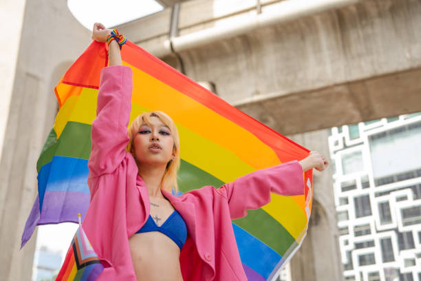 istock Confident Gay Boy Holding Rainbow Flag. 2149414896
