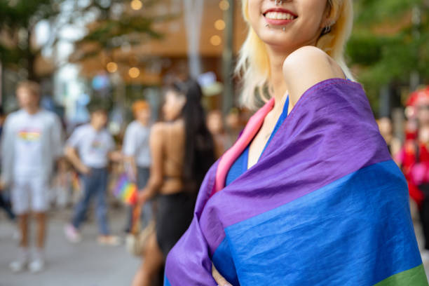 istock Confident Gay Boy Holding Rainbow Flag. 2149415022