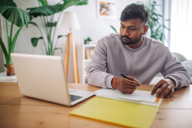 istock Young indian man working from home 2149415195