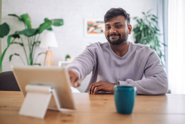 istock Young indian man working from home 2149415997