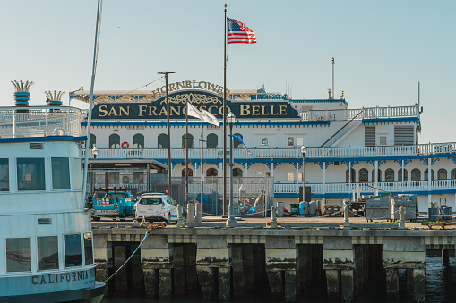 San Francisco, California, April 8, 2024. The San Francisco Belle stands proudly behind the moored ferry, American spirit on full display.