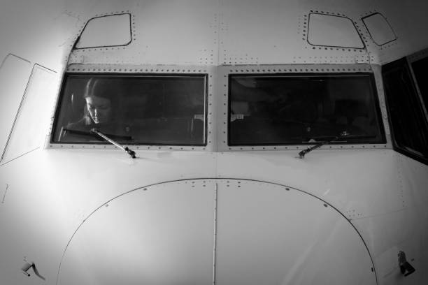 pilot cap with goggles on an old airplane