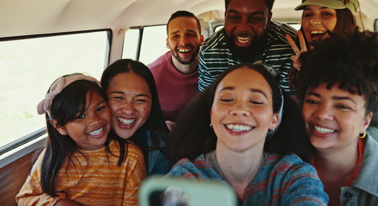 Selfie, road trip and friends in a van happy, smile and show peace sign while bonding in freedom. Social media, profile picture and group of people with child in a camper excited for traveling photo
