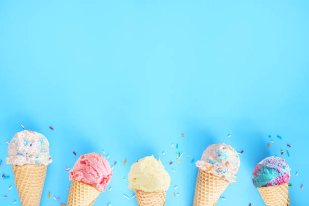 istock Ice cream cone bottom border over a blue background 2149418387