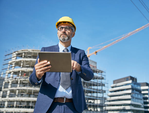 istock businessman construction site business architect building engineer builder tablet helmet architecture blueprint worker man contractor adult engineering industry 2149419568