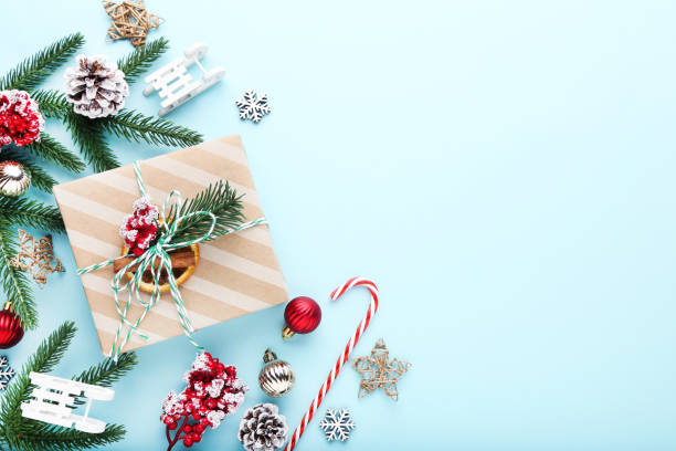 istock Gift box with ornaments on blue background 2149419750