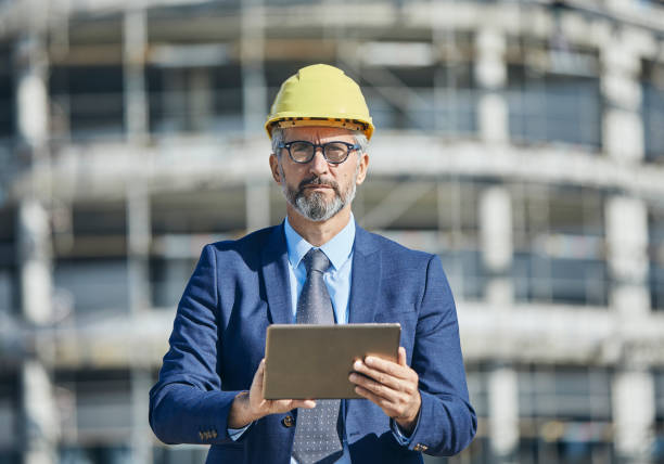 istock businessman construction site business architect building engineer builder tablet helmet architecture blueprint worker man contractor adult engineering industry 2149419764