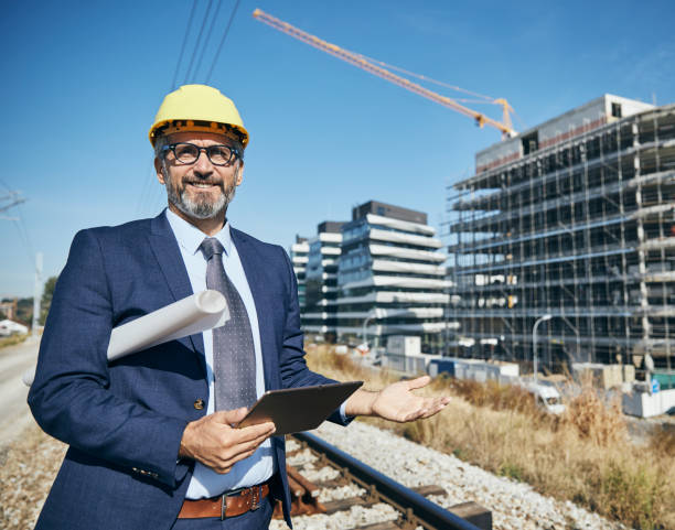 istock businessman construction site business architect building engineer builder tablet helmet architecture blueprint worker man contractor adult engineering industry 2149419819
