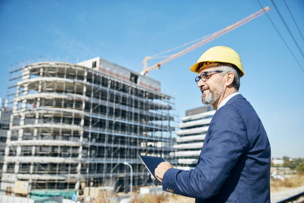 istock businessman construction site business architect building engineer builder tablet helmet architecture blueprint worker man contractor adult engineering industry 2149419852