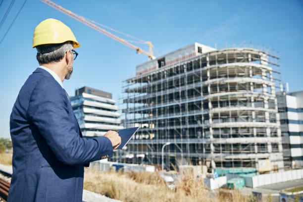 istock businessman construction site business architect building engineer builder tablet helmet architecture blueprint worker man contractor adult engineering industry 2149419891