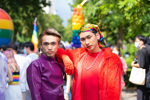 Gay Asians enjoying the Pride parade on the streets of Thailand.