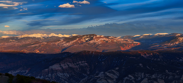 Sawatch Dramatic Mountain Landscape at Sunset - Rugged peaks including New York Mountain and Gold Dust Peak with pink-orange warm sunset light and dramatic clouds. Sawatch Range near Vail and Beaver Creek, Colorado USA.