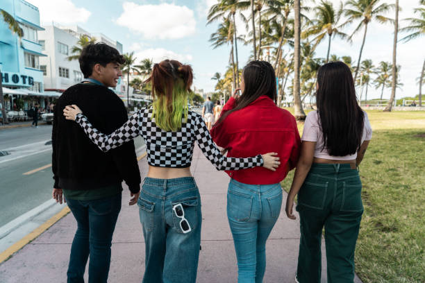 istock Young friends talking and walking through the city 2149423051