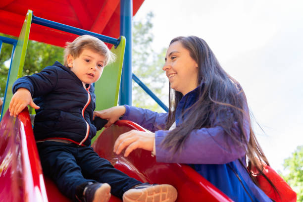 istock Mother and her son playing in outdoors playground 2149423319
