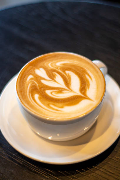 istock Porcelain Coffee Cup Standing On a Wooden Table 2149424118