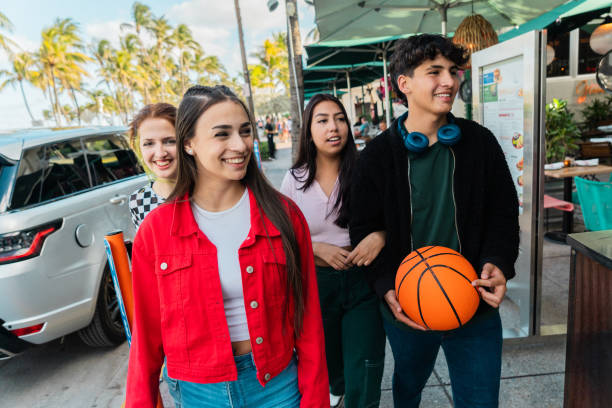 istock Young friends talking and walking through the city 2149424326