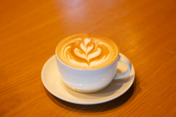 Porcelain Coffee Cup Standing On a Wooden Table