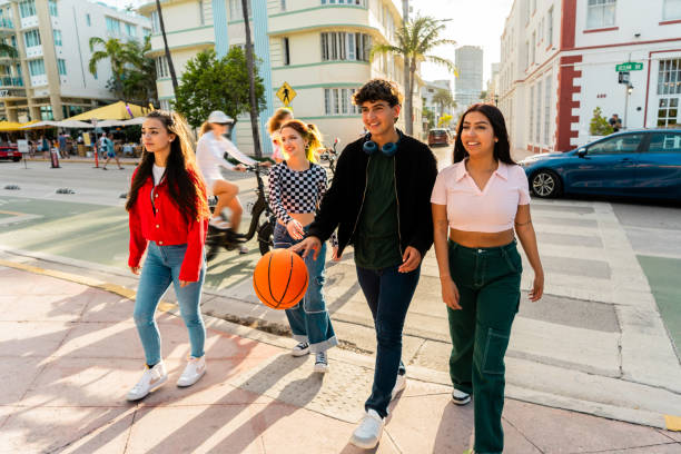 istock Young friends walking through the city 2149426243