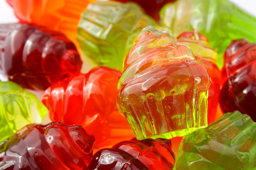Gummies of different colors in the shape of a cupcake