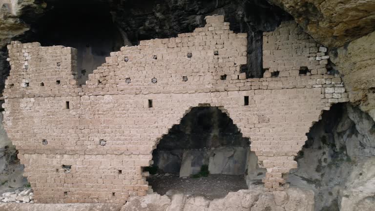 Drone footage showcases the ancient Christian rock church, an architectural relic dating back to the 7th century Eastern Roman Empire. Its historical significance as a religious site is highlighted
