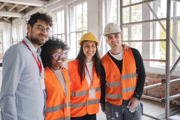 istock Multiracial construction workers and building contractor together on construction site 2149432108