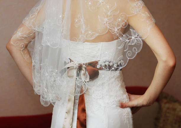 istock Brown bow on the bride's wedding dress 2149432187