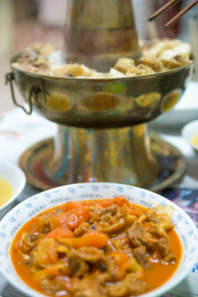 traditional chinese copper hot pot with beef tomato stew