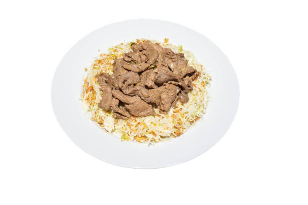 Bo bap thau or beef salad. A Vietnamese dish. Shredded cabbage is mixed with lime juice and spicy fish sauce. Beef is marinated with chopped shallots and lemongrass before being stir-fried. The beef was then combined with grated cabbage and fried shallots.