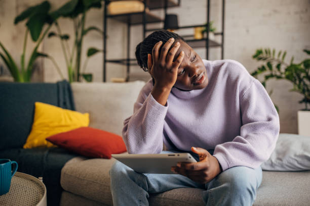 istock Young woman feeling stressed at home 2149439517