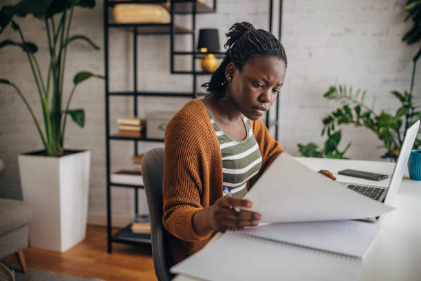 istock Focused young woman working from home 2149444911
