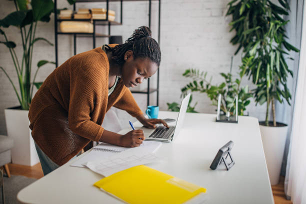 istock Young black woman working from home 2149445092