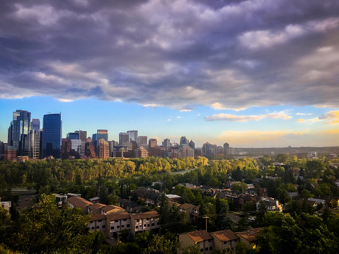 Moody, stormy skies approaching downtown Calgary. Calgary is known for being near the Canadian Rockies and hosting the famous Calgary Stampede Rodeo Festival.