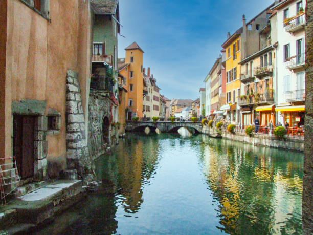 Canal  city displaying the reflection of colourful building on the water.
