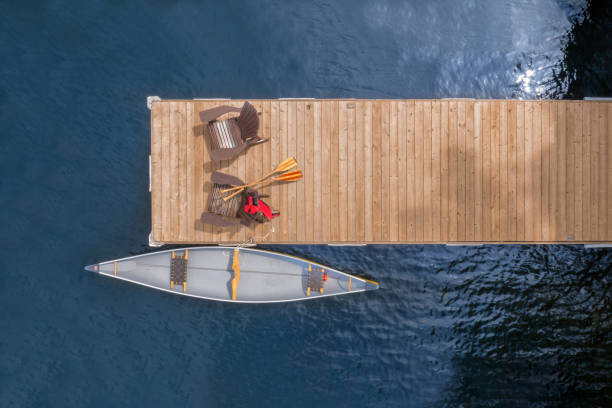 istock Aerial View of Adirondack Chairs by Serene Waters 2149445933