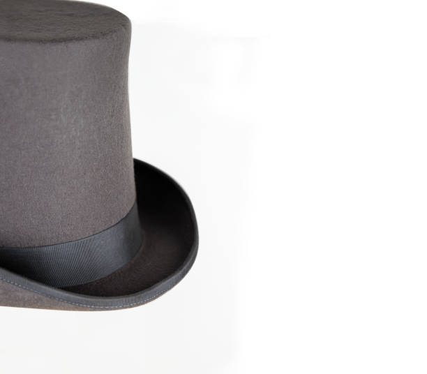 istock Magic hat. Topper. Elegant vintage gray beige wool felt top hat with black band. Grosgrain ribbon trim around rolled brim. Isolated on white background. Close-up. Copy space. Cut out. Clipping path. 2149446143