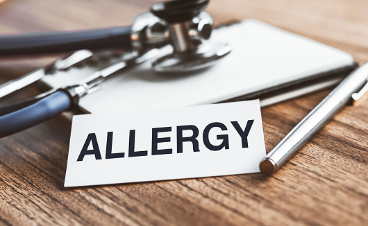 ALLERGY word on a paper with stethoscope and pen