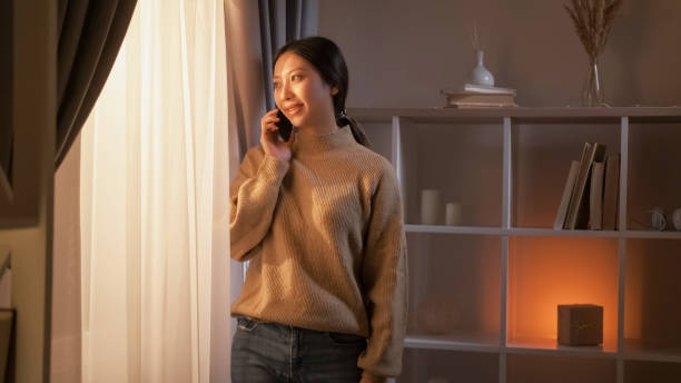 istock Phone talk mobile communication cheerful woman 2149447457