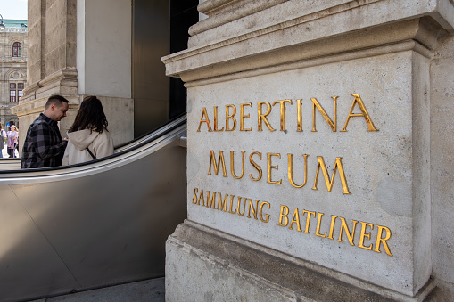 Vienna, Austria April 5, 2024 Peoiple ride an escalator to the Albertina Museum.