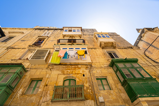 Valletta, Malta, April 03, 2024. view of the typical wooden balconies in the old buildings in the city center