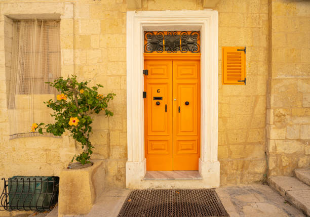 Valletta, Malta, April 03, 2024.  external view of the typical entrance doors of houses in the city center