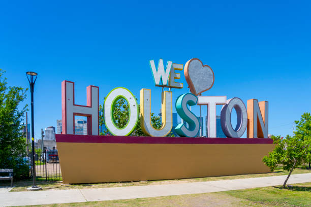 the sign ‘we love houston’ with downtown houston in background is shown. houston, texas, usa. - houston-texas bildbanksfoton och bilder