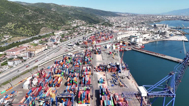 Aerial view of damaged cranes in a port. Large container ship crashed into cranes in the port and the cranes were damaged. Aerial view. 4K resolution.