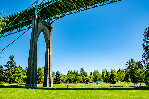 Arch of St. Johns Bridge in Cathedral Park on Summer Day in Portland, OR
