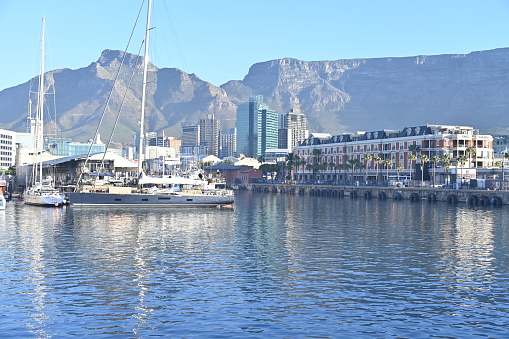 Cape Town, South Africa - March 30, 2024 - The V&A Waterfront in Cape Town is one of the most popular tourist destinations in South Africa. Located on the edge of the city’s busy harbour, the V&A offers a wide range of shopping, dining and entertainment options. The area is home to a number of markets, restaurants, pubs and clubs, as well as the popular Two Oceans Aquarium. There is something for everyone making it the perfect place to spend a day or two exploring.