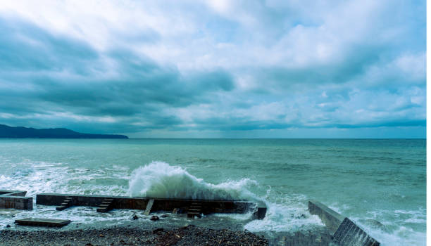 small storm on the sea, waves hitting the shore