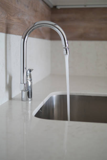 istock water pouring from a faucet tap slow motion 2149466857