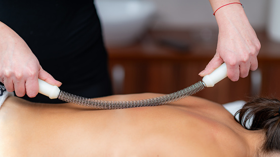 Body shaping massage as a metal rolling pin creates sculpted serenity, highlighting the elegance of this therapeutic treatment